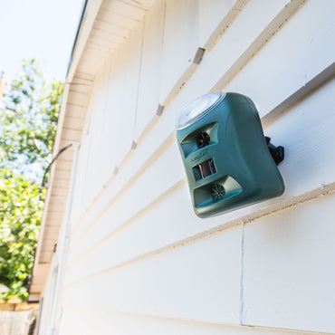 The Guardian Pest Repeller mounting on the side of a house.