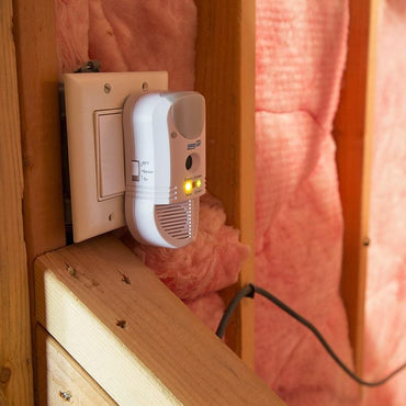 Pest Repeller Ultimate® AT plugged into an outlet in the garage